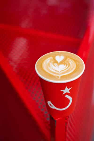 Ritual coffee in a to go cup on the edge of a table