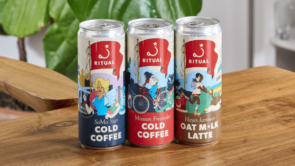 Ritual's three canned coffees on a wooden table