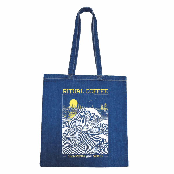 Denim tote bag with illustration of waves forming latte art